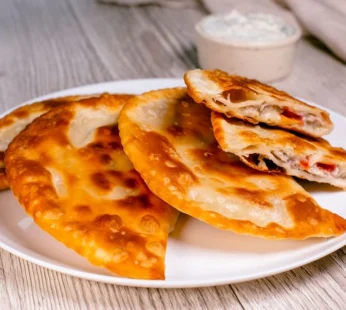 Chebureki with Pork, Tomatoes, and Cheese